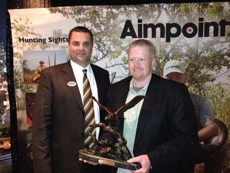 Dave Pasienski, Director of Aimpoint Commercial Sales (Left) and Michael Jennings, MidwayUSA Optics Product Line Manager at the 2013 SHOT Show Dave Pasienski, Director of Aimpoint Commercial Sales (Left) and Michael Jennings, MidwayUSA Optics Product Line Manager at the 2013 SHOT Show