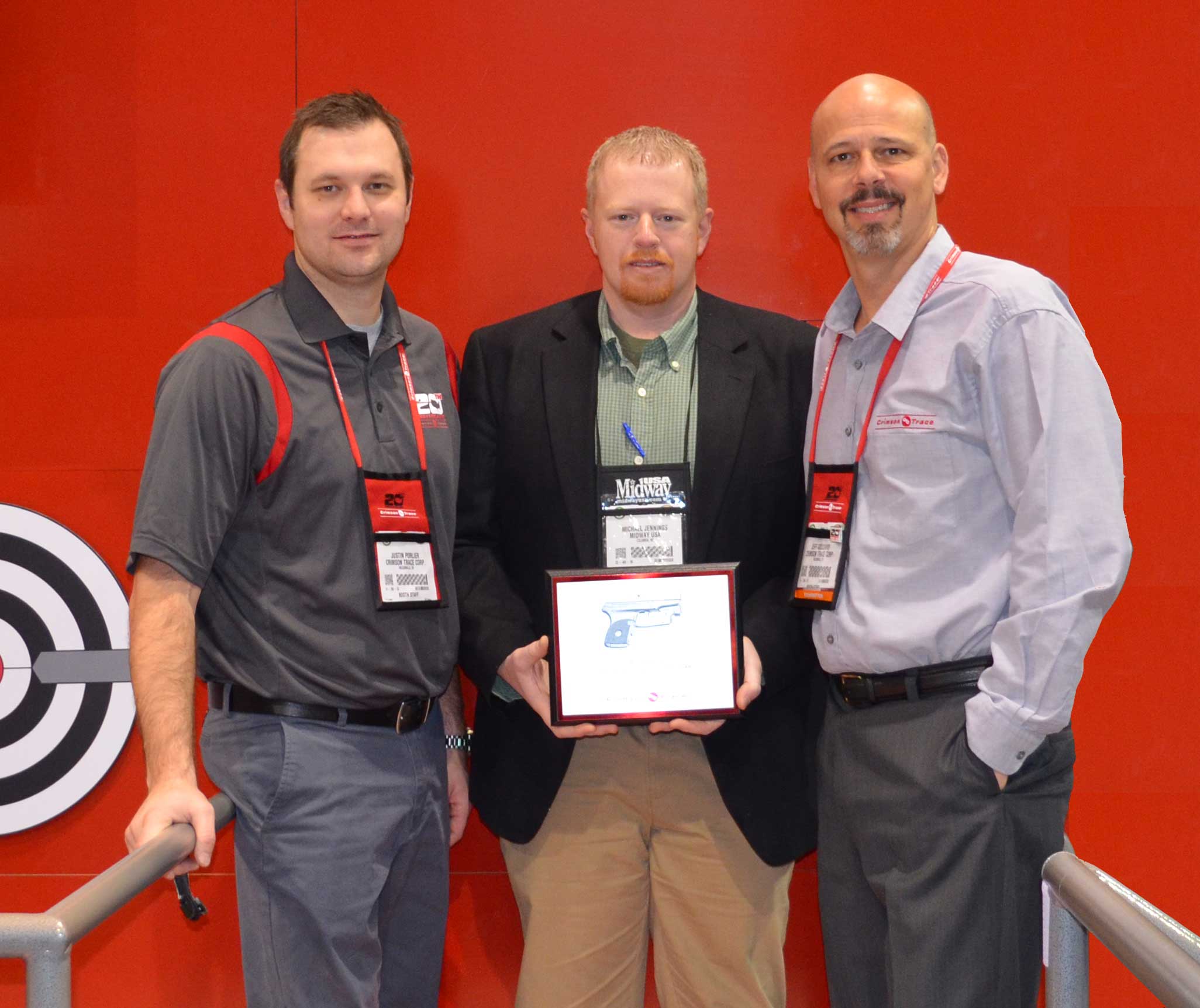 Crimson Trace Presenting Michael Jennings, MidwayUSA Optics Product Line Manager, with Elite Retailer of the Year Award Crimson Trace Presenting Michael Jennings, MidwayUSA Optics Product Line Manager, with Elite Retailer of the Year Award